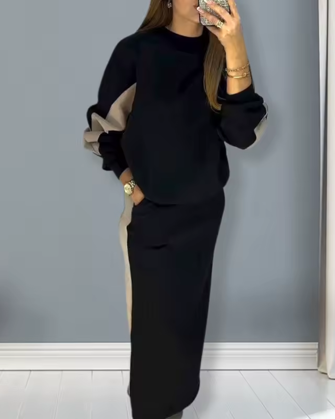 Conjunto holgado con top de manga larga y falda con abertura